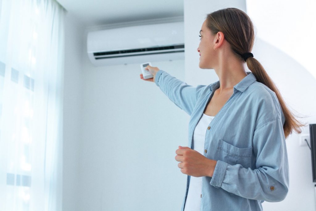 Woman Turning AC Off